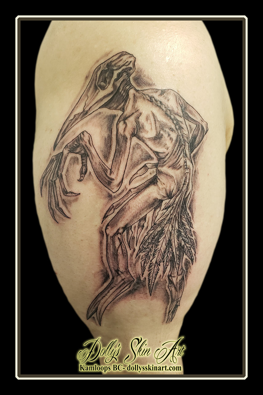 bird man tattoo black and grey shading shoulder arm skull feathers tattoo dolly's skin art kamloops