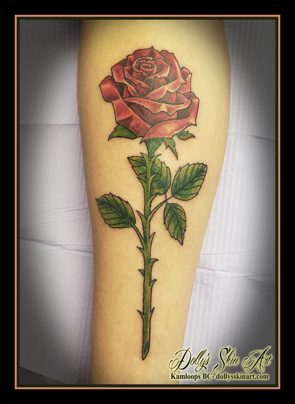 rose tattoo colour red green forearm floral white black tattoo kamloops dolly's skin art