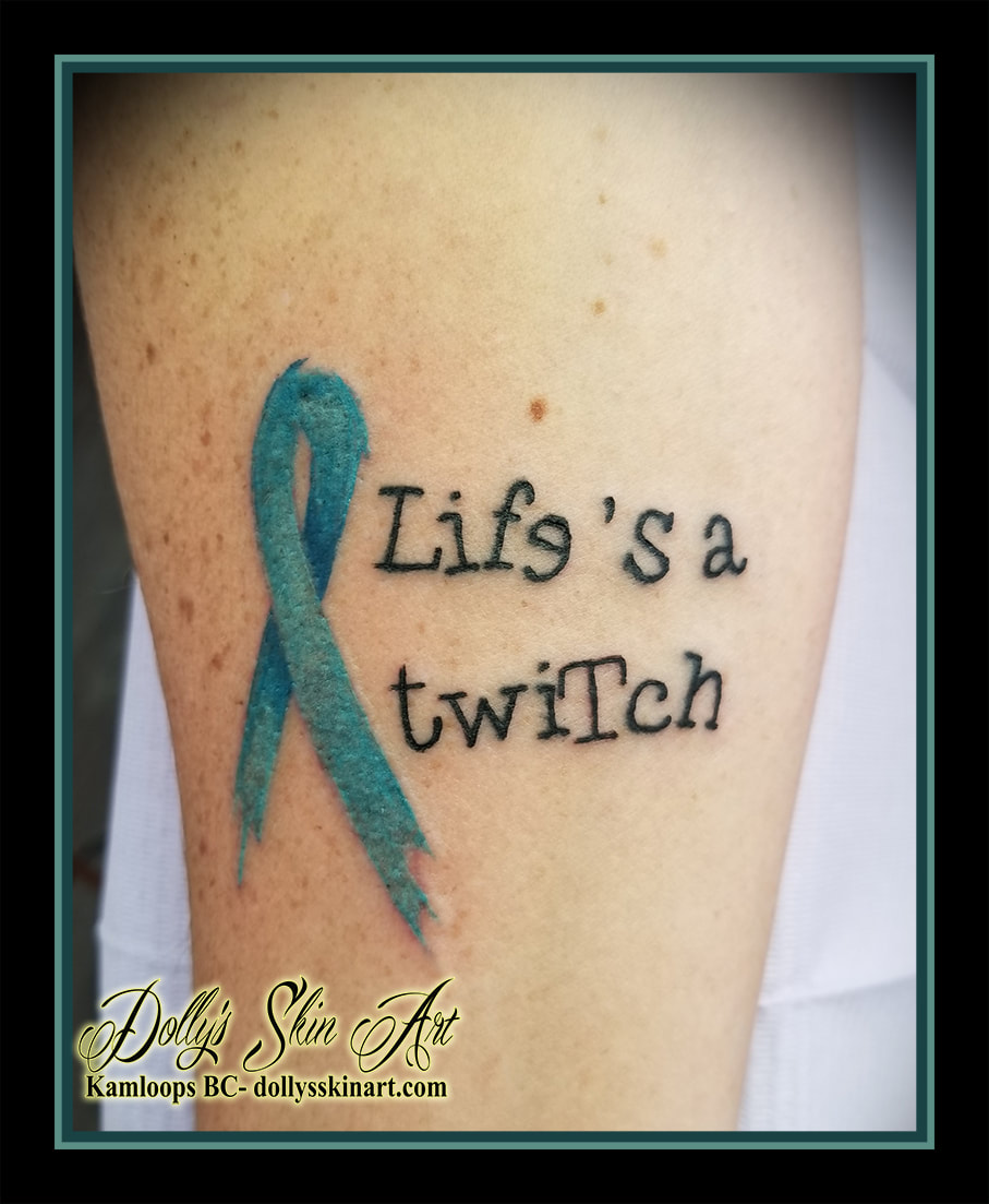 life's a twitch blue ribbom typewriter font lettering script arm forearm tattoo kamloops tattoo dolly's skin art