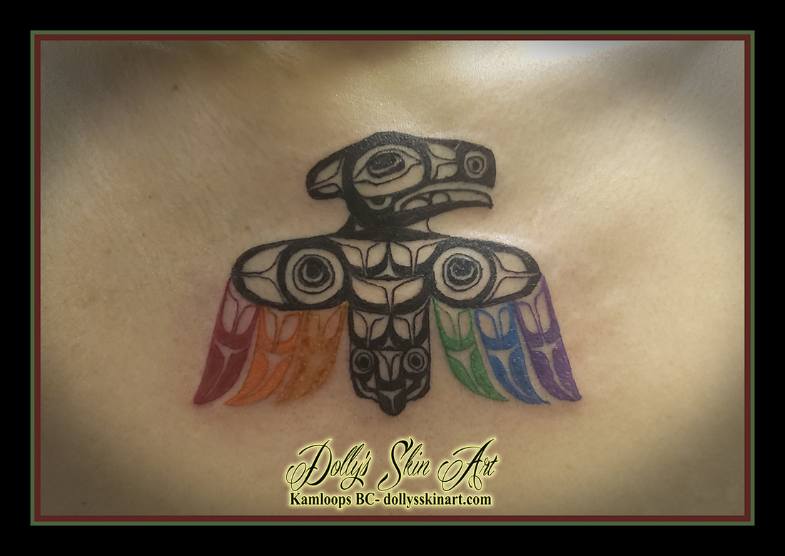 rainbow raven tattoo indigenous art black red orange yellow green blue purple chest tattoo dolly's skin art kamloops