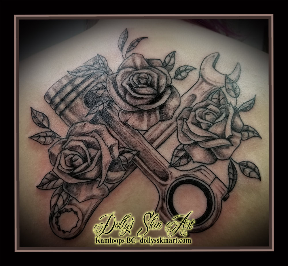 black and grey tattoo piston roses wrench mechanic flowers shading back tattoo kamloops dolly's skin art