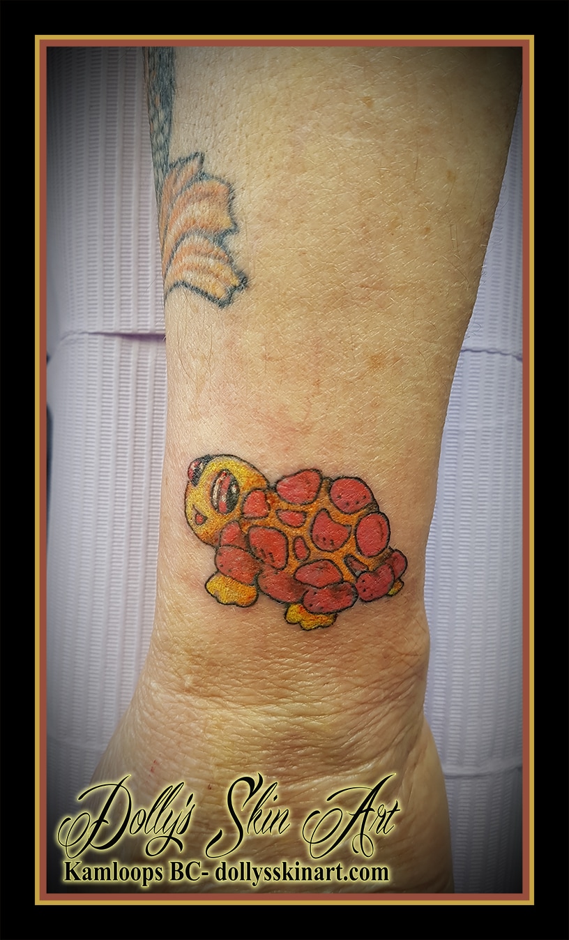 small animated cartoon colour red orange yellow turtle wrist tattoo kamloops dolly's skin art