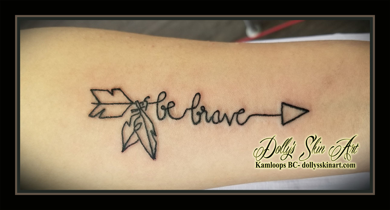 black line work be brave arrow script feather tattoo kamloops dolly's skin art