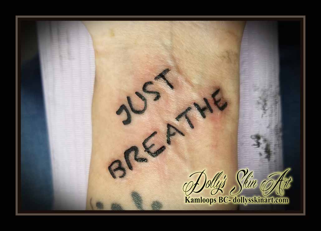 just breathe tattoo black lettering wrist font script tattoo kamloops dolly's skin art