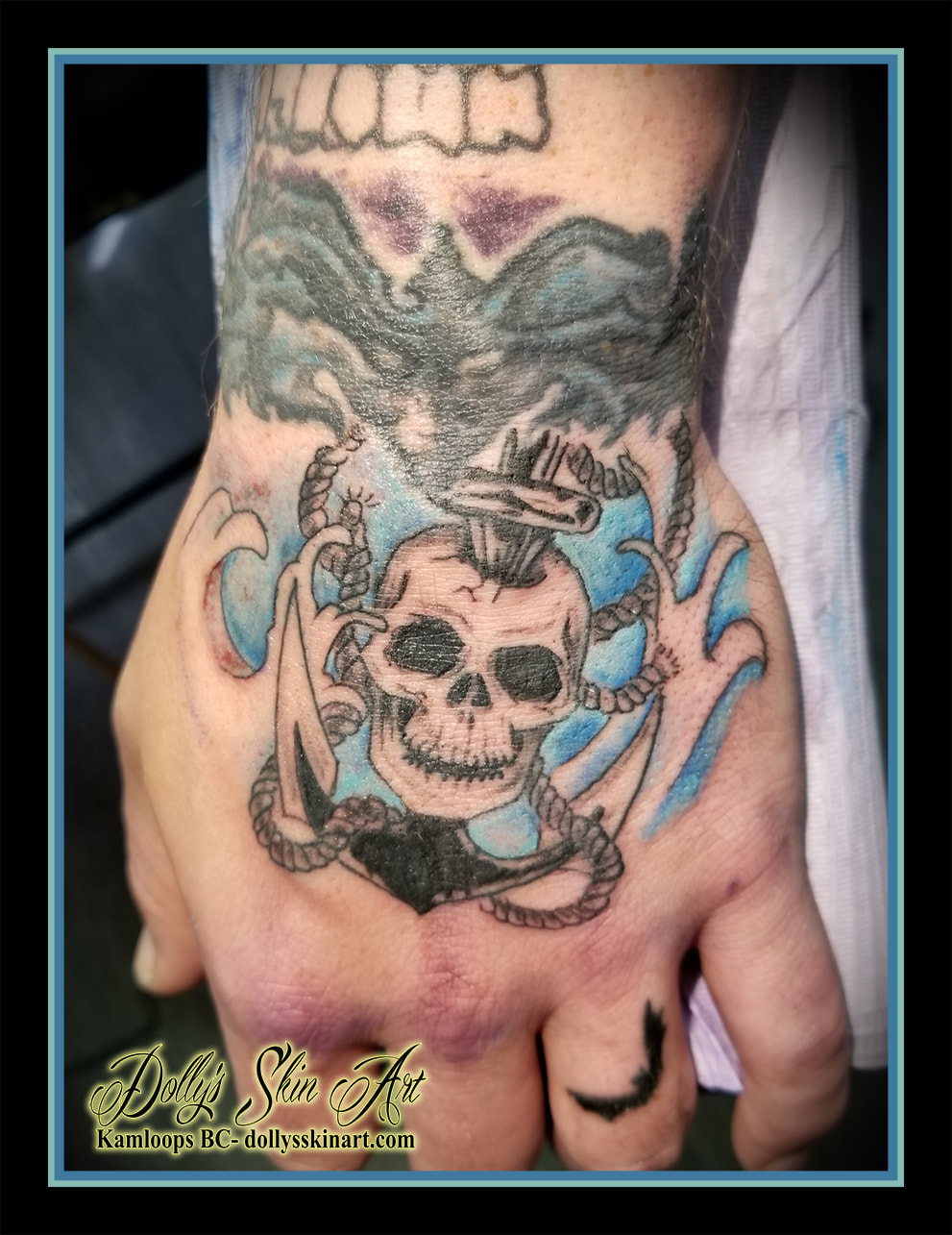 black and grey skull anchor rope waves water blue shading hand tattoo kamloops tattoo dolly's skin art