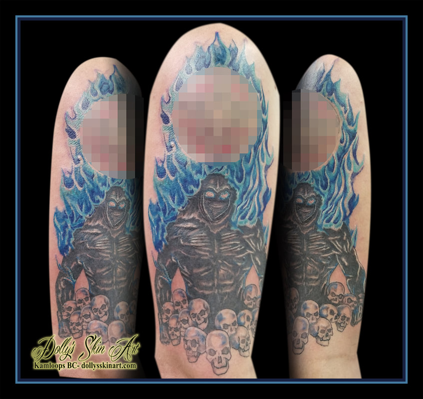 disturbed indestructable tattoo album cover art skulls fire black blue shoulder bicep tattoo kamloops dolly's skin art