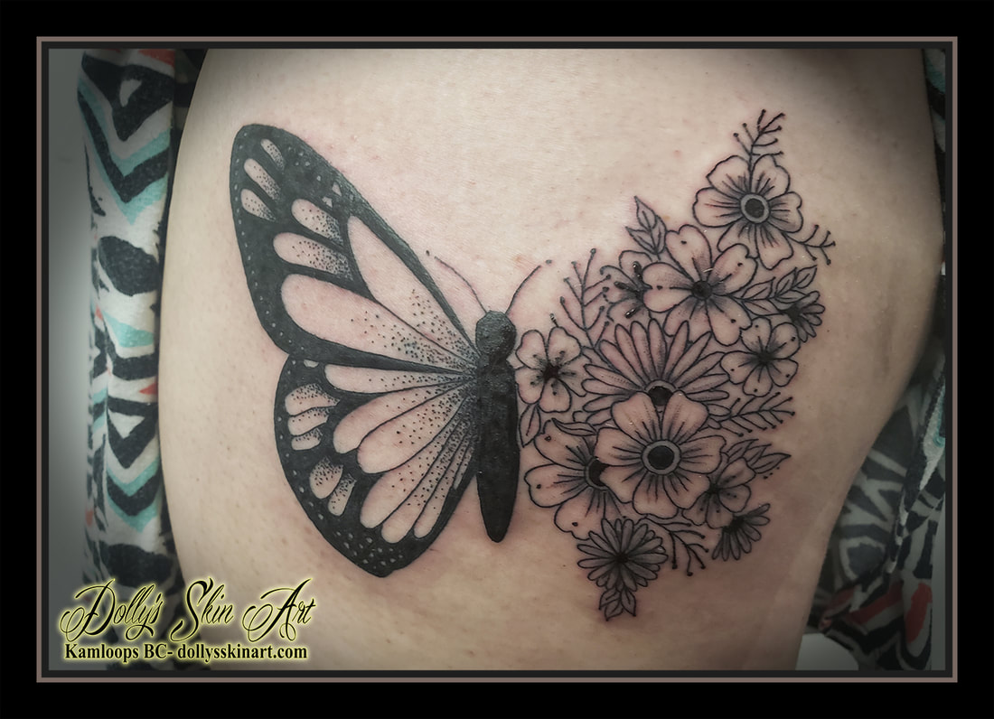 butterfly floral tattoo flowers black and grey shading dotwork thigh leg tattoo kamloops dolly's skin art