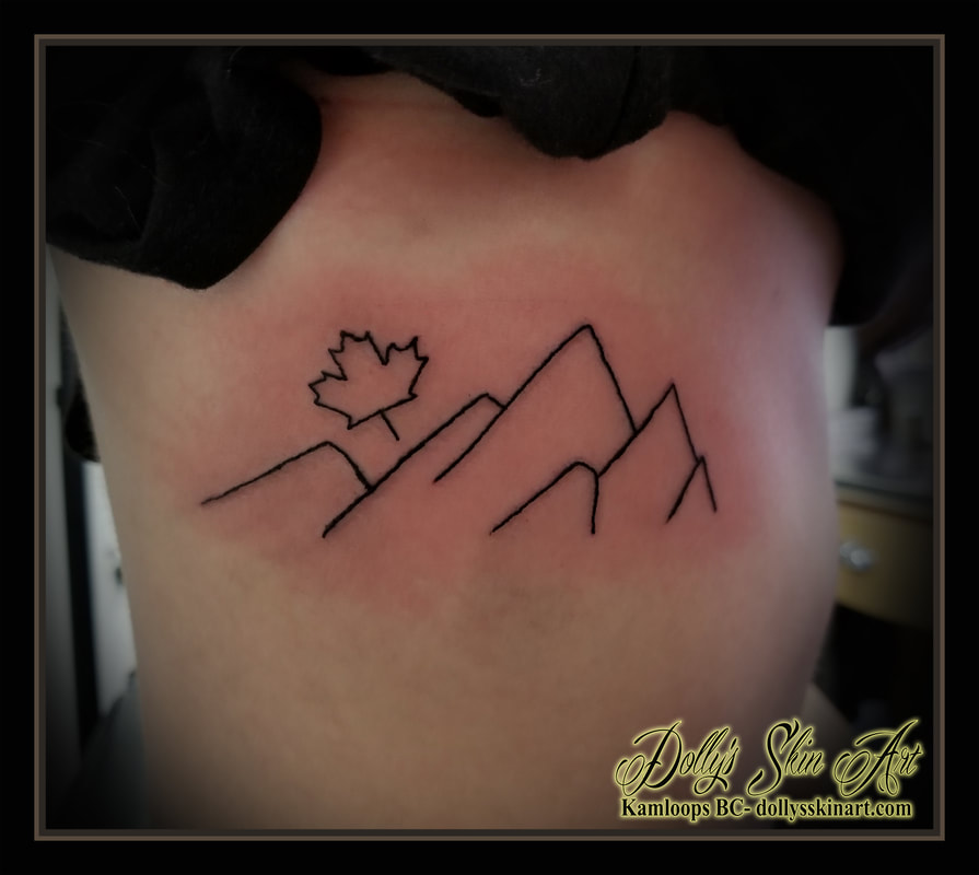 black linework line mountain maple leaf canada canadian outline rib tattoo kamloops dolly's skin art