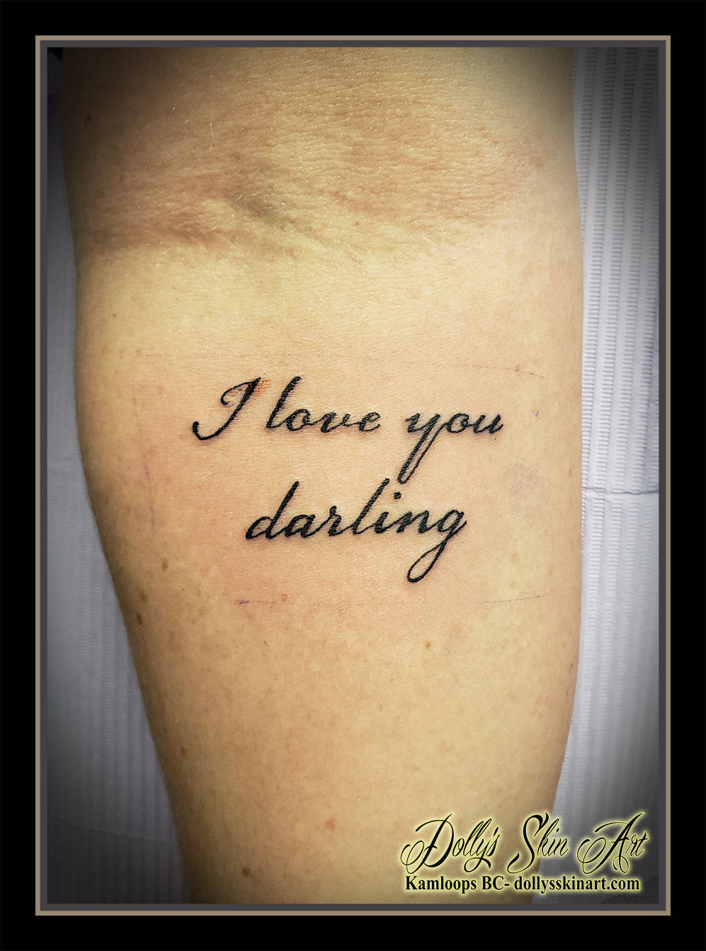 I love you darling tattoo black lettering script font forearm tattoo kamloops dolly's skin art