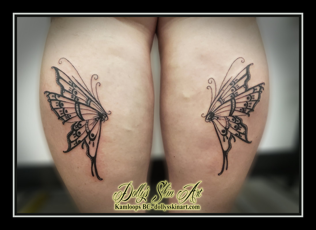 butterfly tattoo butterflies back of calf black linework left right balanced half butterflies tattoo dolly's skin art kamloops