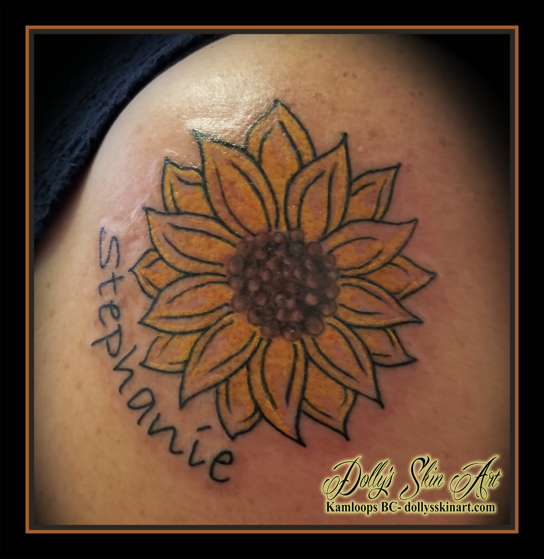 birth flower tattoo daughter children sunflower yellow brown lettering font script stephanie floral tattoo kamloops dolly's skin art
