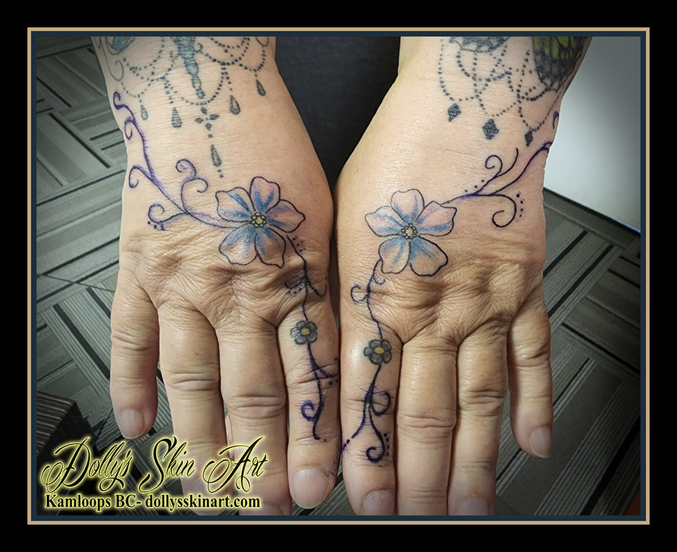 filigree tattoo floral flowers hand fingers colour black blue yellow tattoo dolly's skin art kamloops