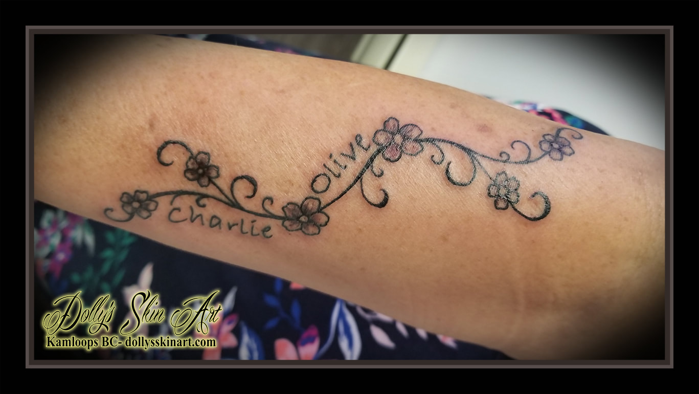 family vine tattoo grand children charlie olive flowers forearm lettering font script black pink filigree tattoo kamloops dolly's skin art