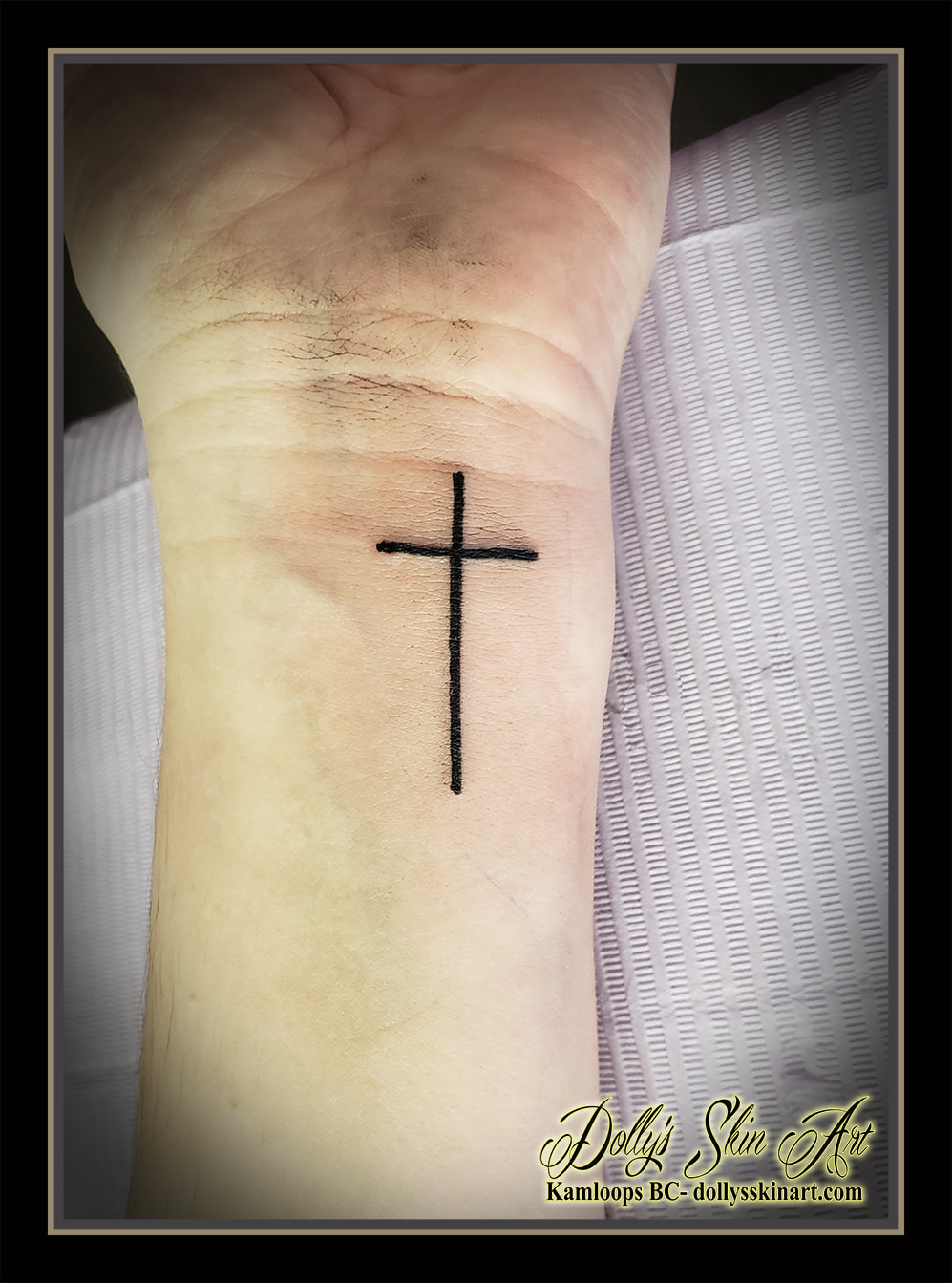 cross tattoo simple black wrist tattoo kamloops dolly's skin art