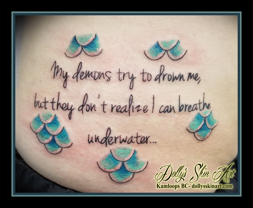 My demons try to drown me but they dont realize i can breathe underwater mermaid scales lettering font script blue side rib tattoo kamloops tattoo dolly's skin art
