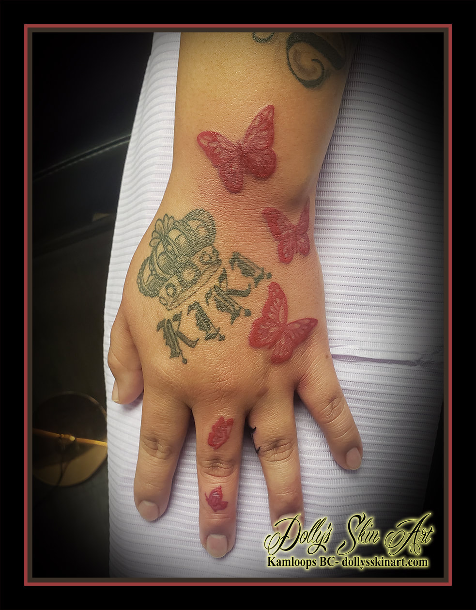 butterfly tattoo red butterflies hand tattoo kamloops dolly's skin art