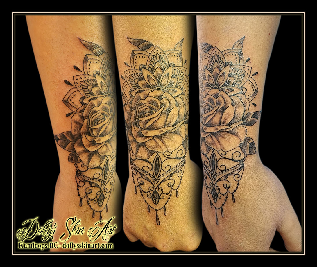 wrist cuff tattoo flowers rose mandala gems chandeliere hand black and grey shading linework tattoo dolly's skin art kamloops british columbia
