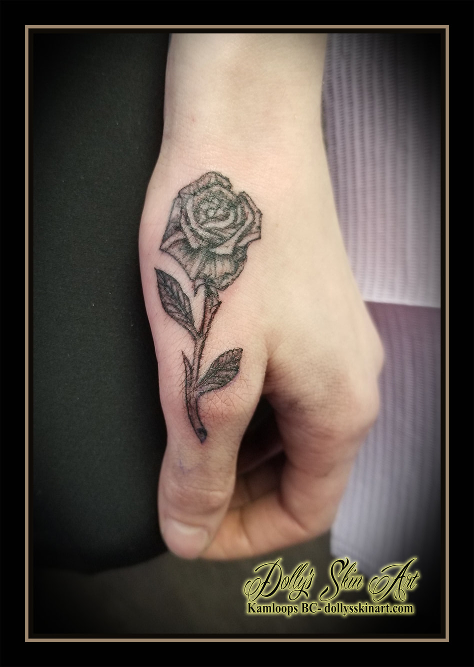rose tattoo black and grey shading hand thumb small tattoo kamloops dolly's skin art