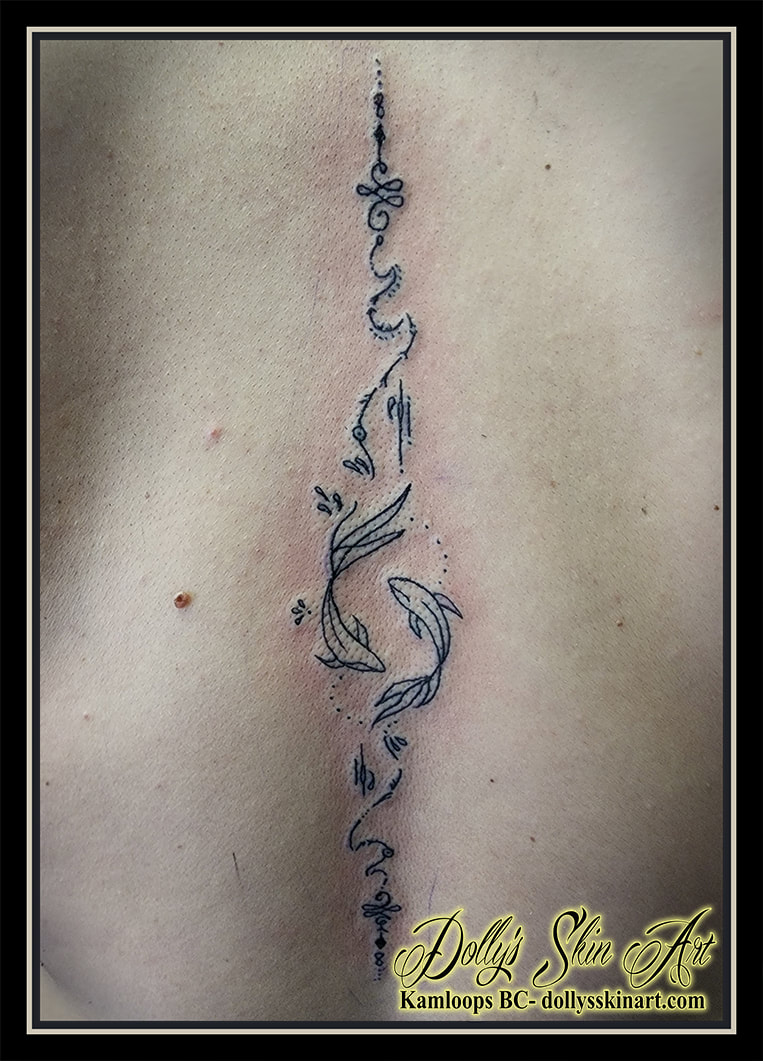 fish tattoo spine linework unalome koi black back tattoo kamloops dolly's skin art