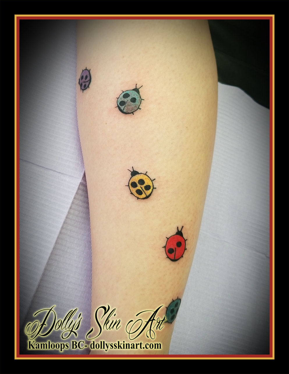 small simple cute ladybug leg tattoo purple green yellow red blue colour kamloops dollys skin art