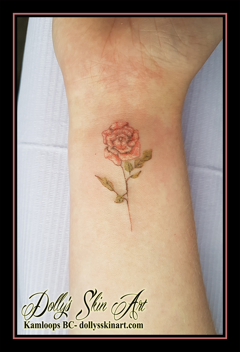 small red green rose wrist simple tattoo kamloops dolly's skin art