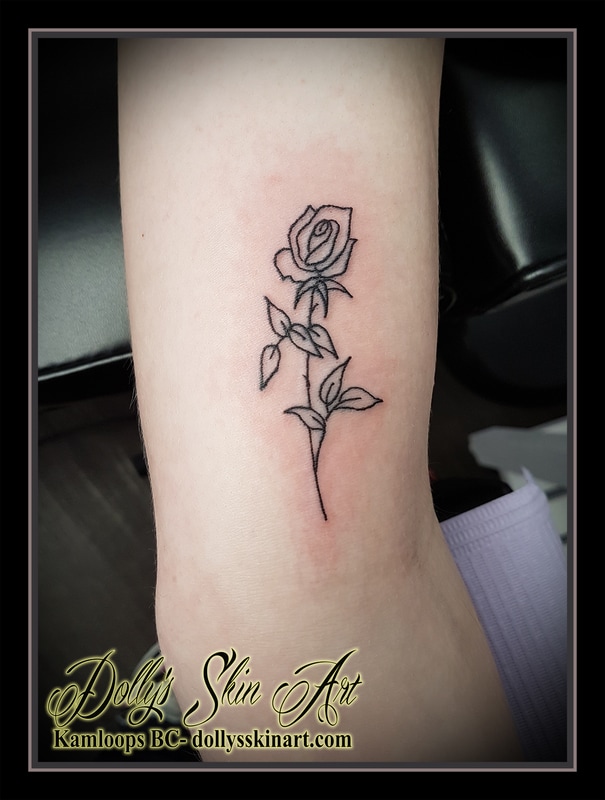 small black simple rose outline linework flower tattoo kamloops dolly's skin art