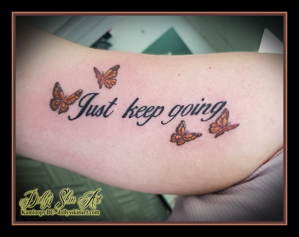 just keep going tattoo butterflies butterfly colour bicep black yellow brown orange script font lettering tattoo kamloops dolly's skin art