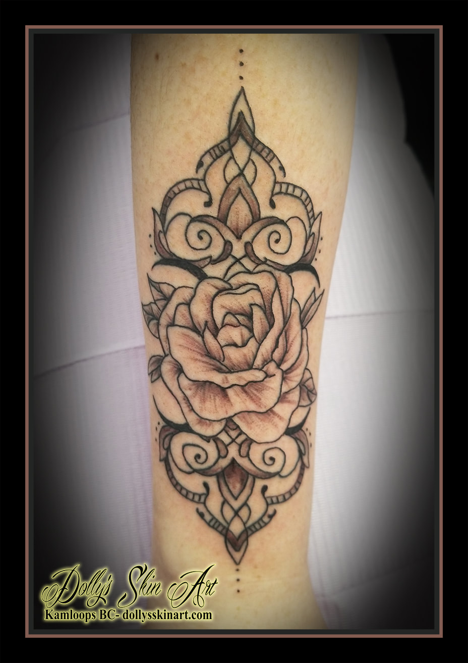 rose tattoo wrist cuff black and grey shading filigree forearm tattoo kamloops dolly's skin art
