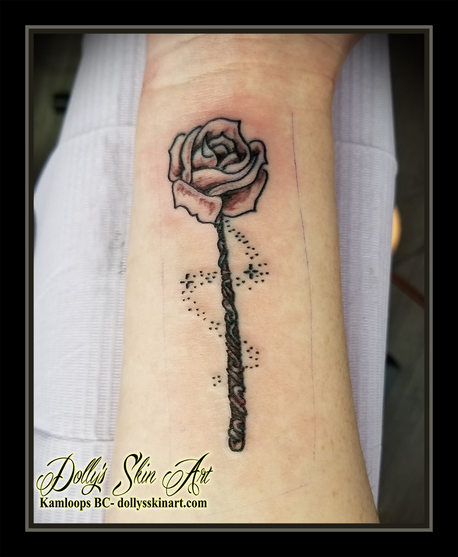 rose wand black and grey shading dots wood magic stars forearm tattoo kamloops tattoo dolly's skin art