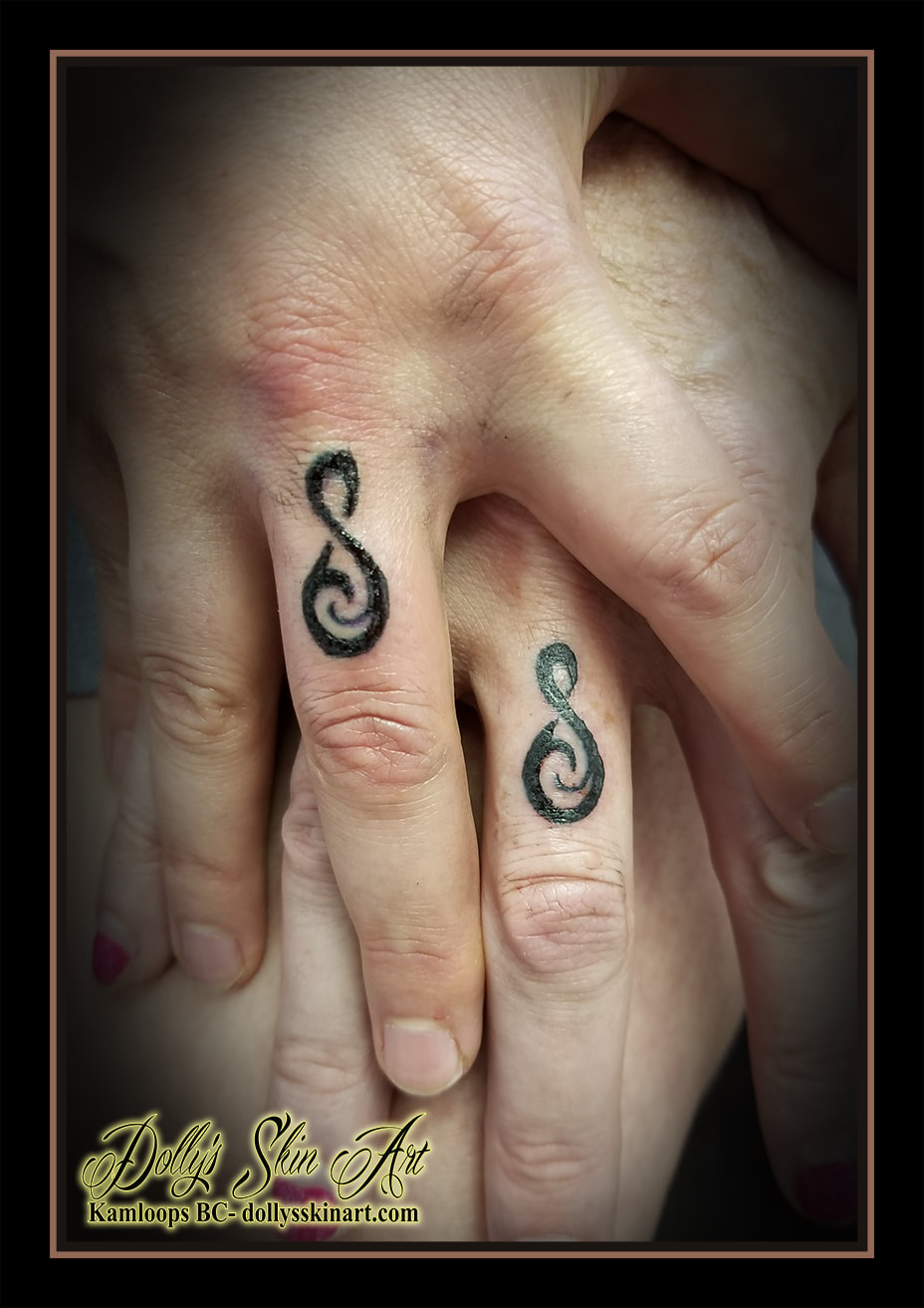 ring finger tattoo matching symbol connection blackwork tattoo kamloops dolly's skin art