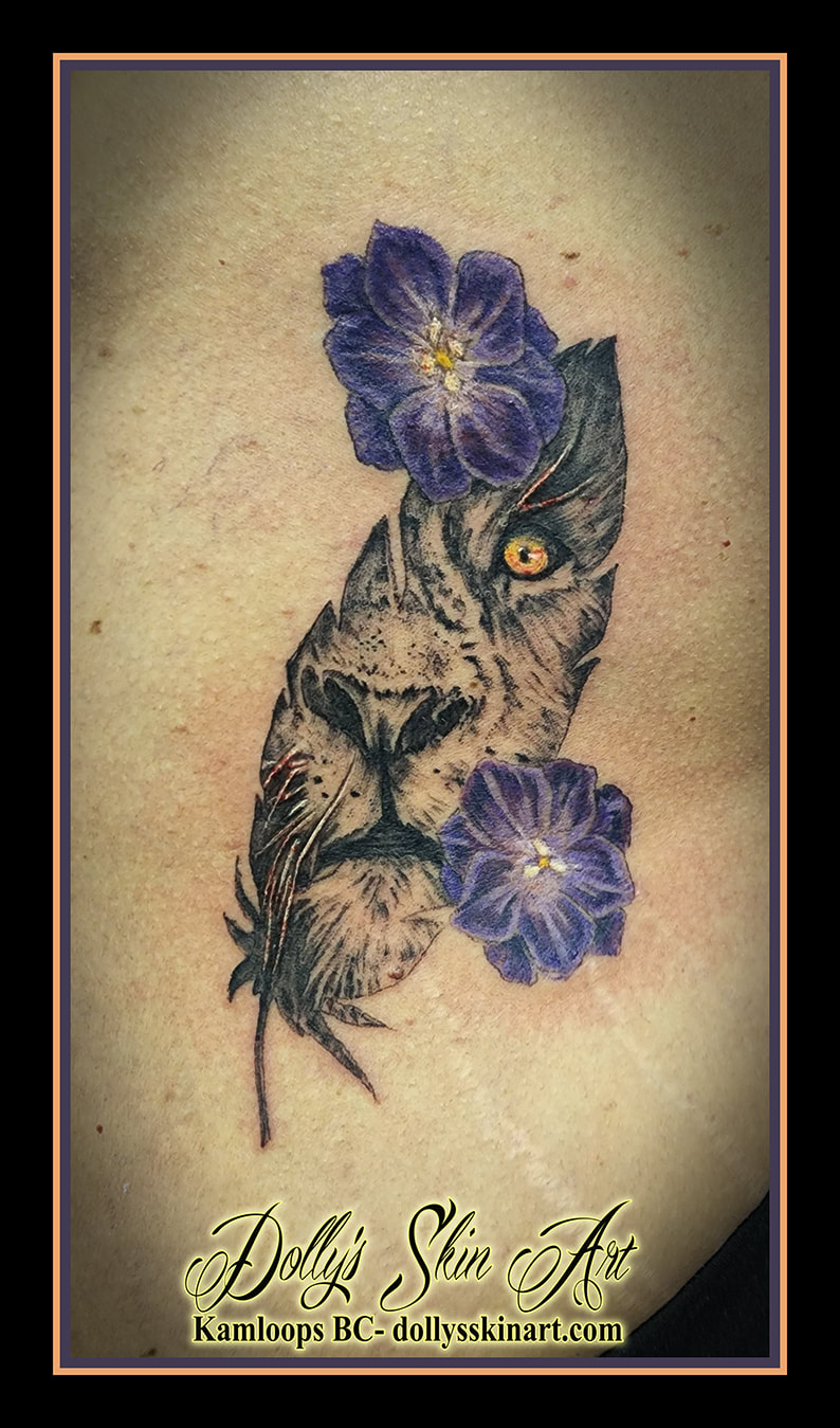 lion tattoo feather flowers face colour black and grey shading blue purple yellow white tattoo dolly's skin art kamloops