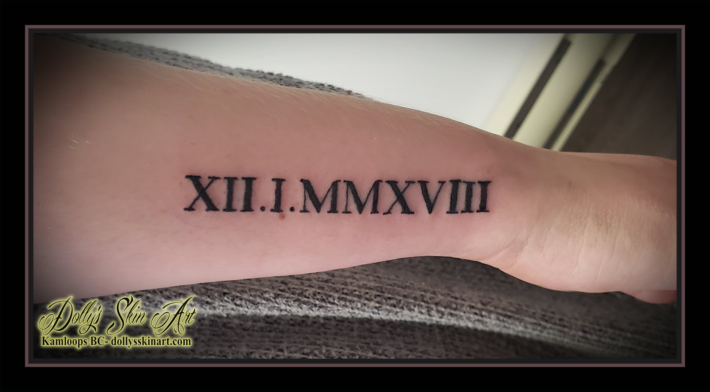 roman numerals tattoo date 12 1 2018 black lettering font script forearm tattoo kamloops dolly's skin art