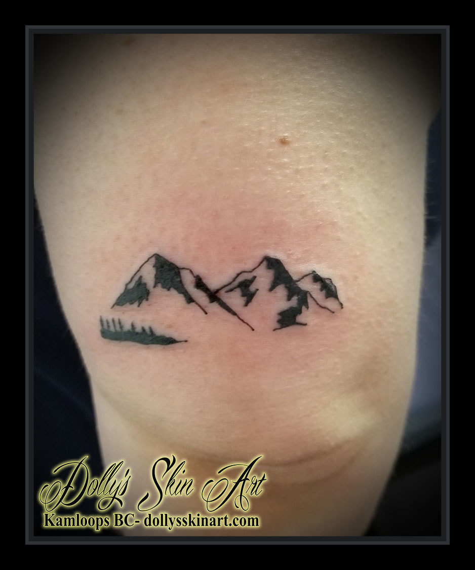 small black mountain forest scene simple linework back of elbow tattoo kamloops dolly's skin art
