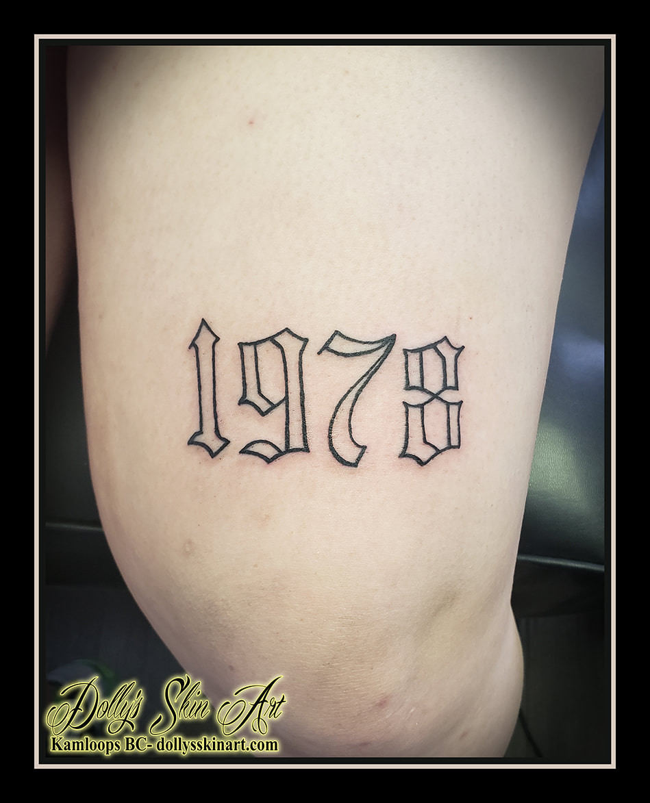 1978 tattoo black and grey linework thigh outline numerals tattoo dolly's skin art kamloops
