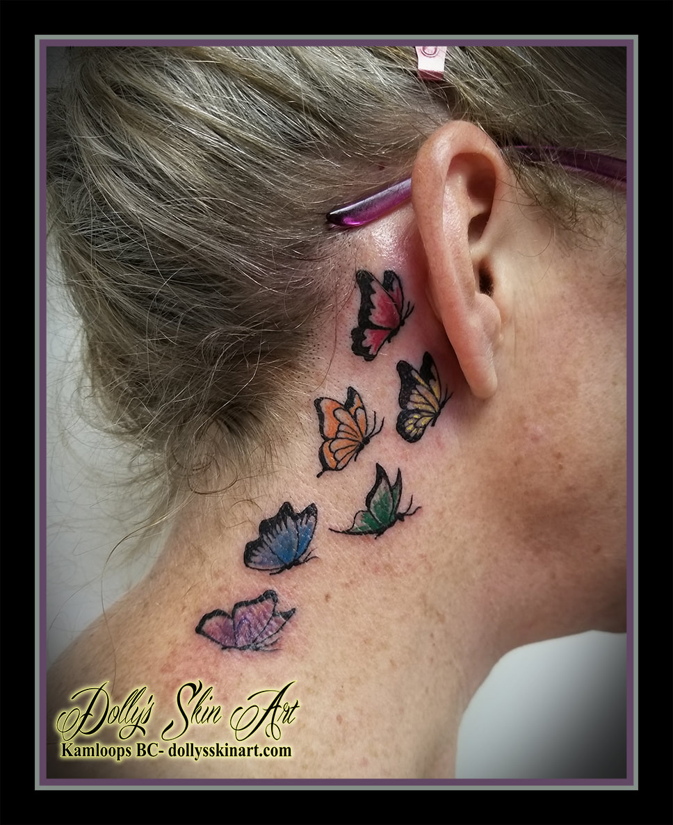butterfly tattoo butterflies behind ear neck hairline colour black red yellow orange green blue purple tattoo kamloops dolly's skin art