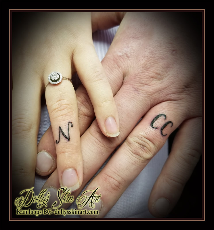 black letter ring finger N CC wedding band lettering font script knuckle finger tattoo kamloops dolly's skin art