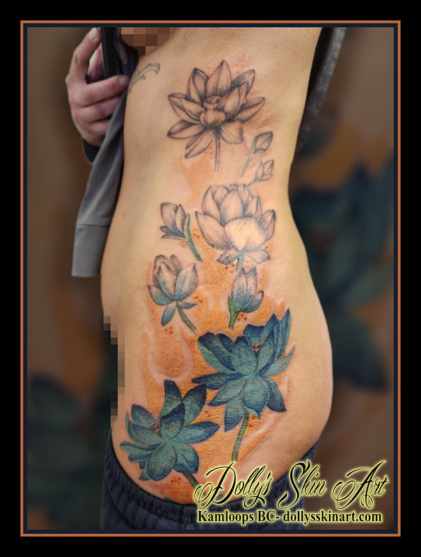 flower tattoo side hip ribs colour black and grey orange blue green tattoo kamloops dolly's skin art