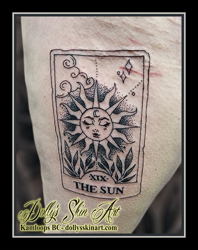 the sun tarot card tattoo black leg linework dotwork stipple dot leaves cloud lettering font script tattoo kamloops dolly's skin art