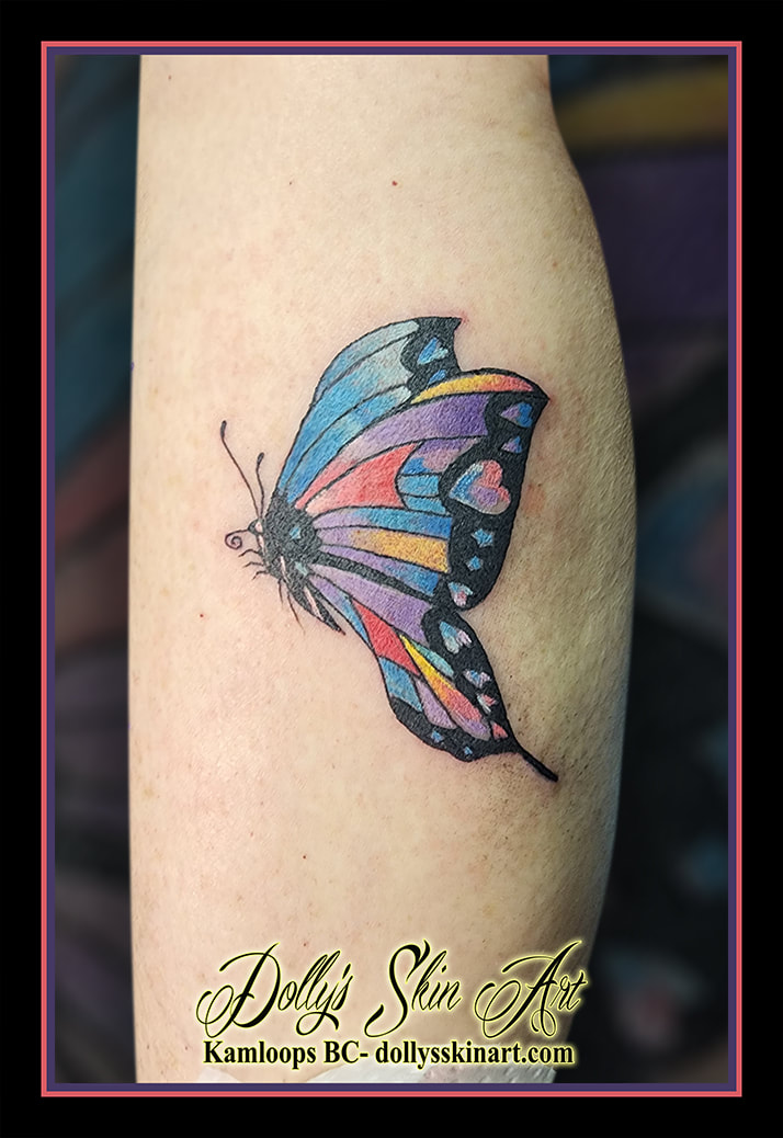 butterfly tattoo colour leg blue black red pink purple yellow tattoo kamloops dolly's skin art