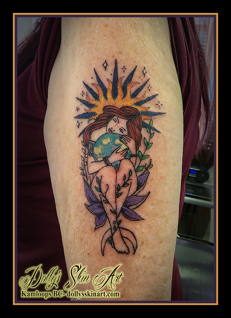 virgo tattoo lady holding earth coloursun vines flower yellow purple blue green black white shoulder arm tattoo dolly's skin art kamloops