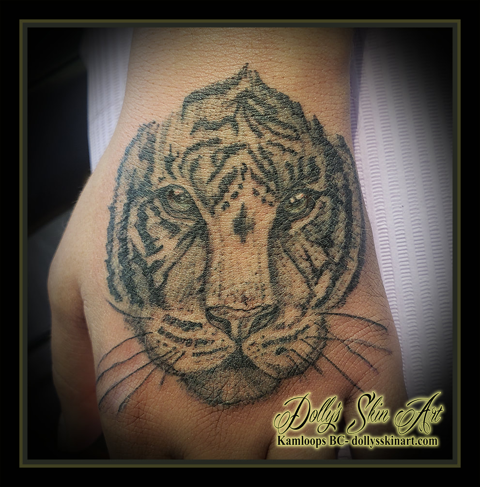 tiger tattoo black and grey shading hand tattoo kamloops dolly's skin art