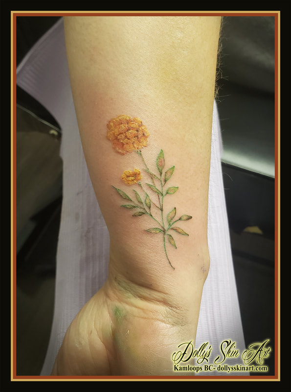 marigold tattoo matching tattoos mother daughter flower floral colour green yellow orange tattoo kamloops dolly's skin art