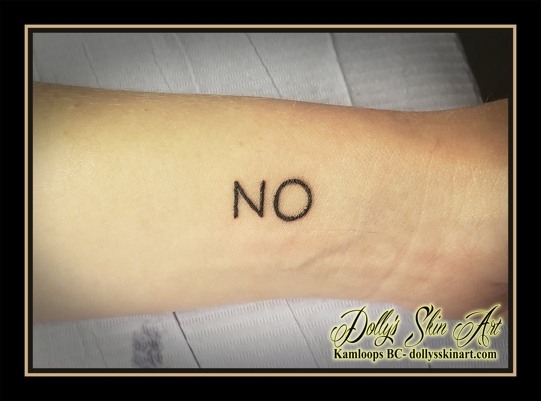 NO tattoo lettering font script wrist black tattoo kamloops dolly's skin art