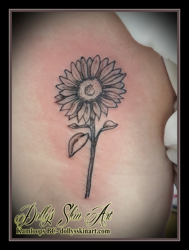black grey shading daisy simple rib tattoo kamloops dolly's skin art