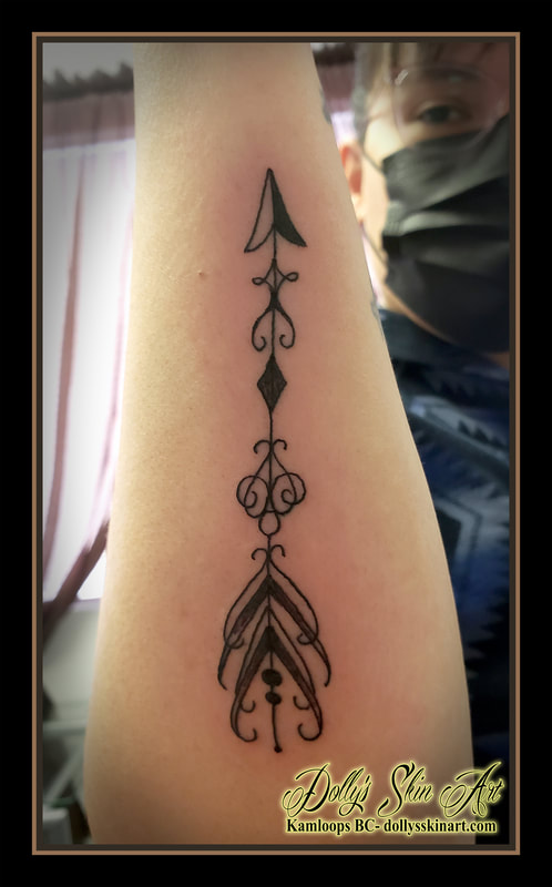 arrow tattoo forearm line black design tattoo kamloops dolly's skin art