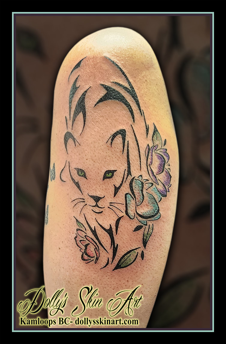 big cat tattoo panther lion tribal black flowers blue purple green pink shoulder arm tattoo kamloops dolly's skin art