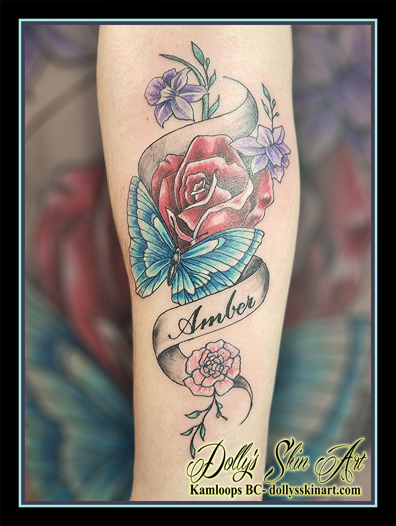 memorial tattoo amber butterfly ribbon lettering font script blue red purple green pink black white rose lily flowers forearm tattoo dolly's skin art kamloops british columbia