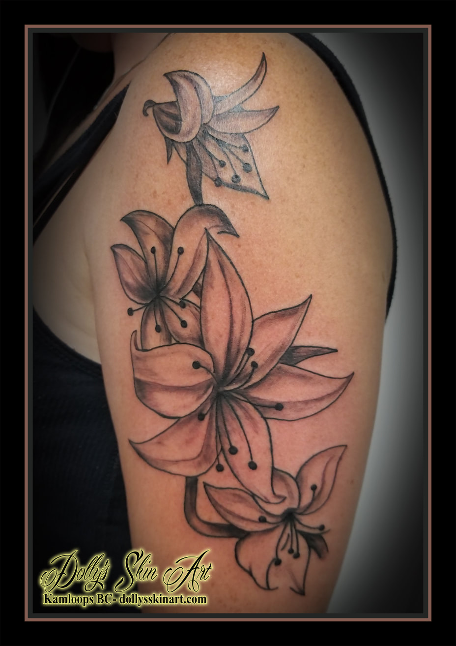 lilies tattoo black and grey shading arm shoulder flowers floral lily tattoo kamloops dolly's skin art