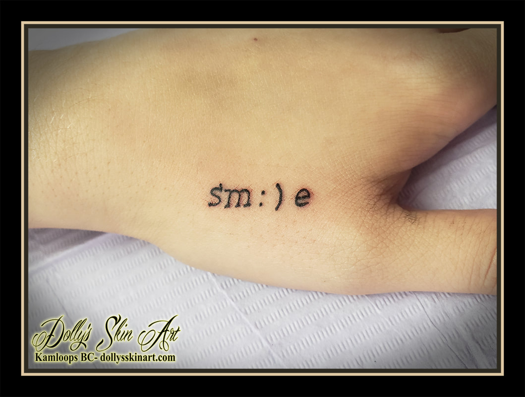 smile tattoo sm:)e lettering black hand small tattoo kamloops dolly's skin art
