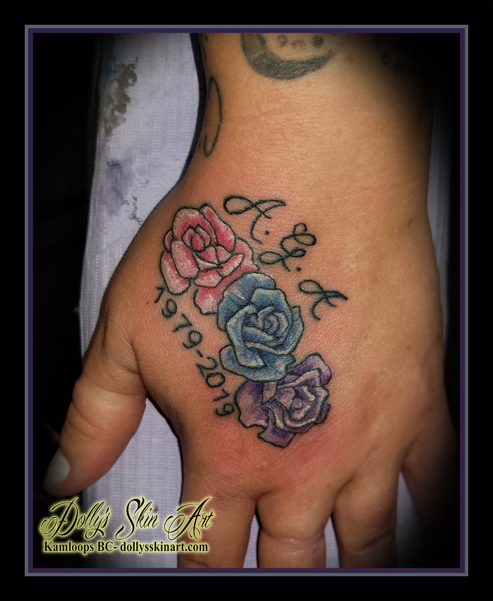 roses hand tattoo memorial flowers floral pink blue purple white lettering font A G A 1979-2019 tattoo kamloops dolly's skin art